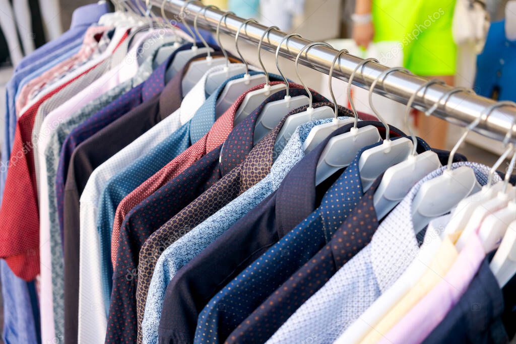 Clothing rack filled with colourful African batik shirts and dresses